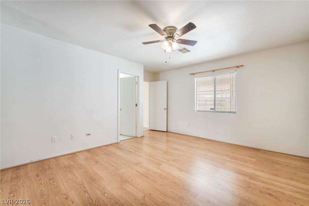 769 Salt Flats Circle, Henderson, NV 89011 Gleaming wood floors anchor this versatile room illuminated by natural light from a central window.