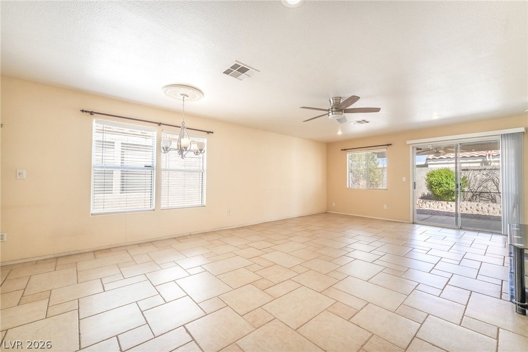 769 Salt Flats Circle, Henderson, NV 89011 Tiled flooring and sliding glass doors define this open, airy main living space.