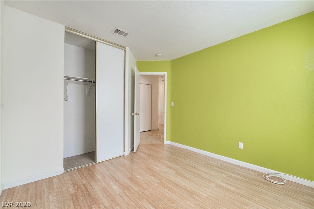 769 Salt Flats Circle, Henderson, NV 89011 Smooth wood-style flooring runs throughout this versatile room featuring a built-in closet with sliding doors.