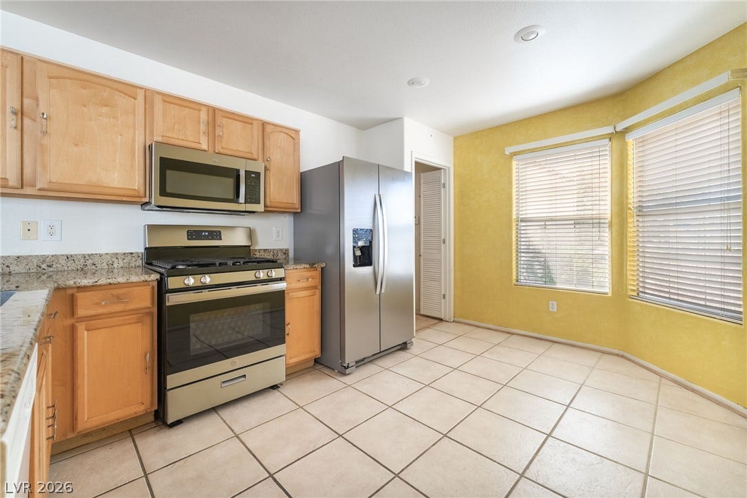 769 Salt Flats Circle, Henderson, NV 89011 Tiled flooring and natural light from large windows define this practical cooking space.