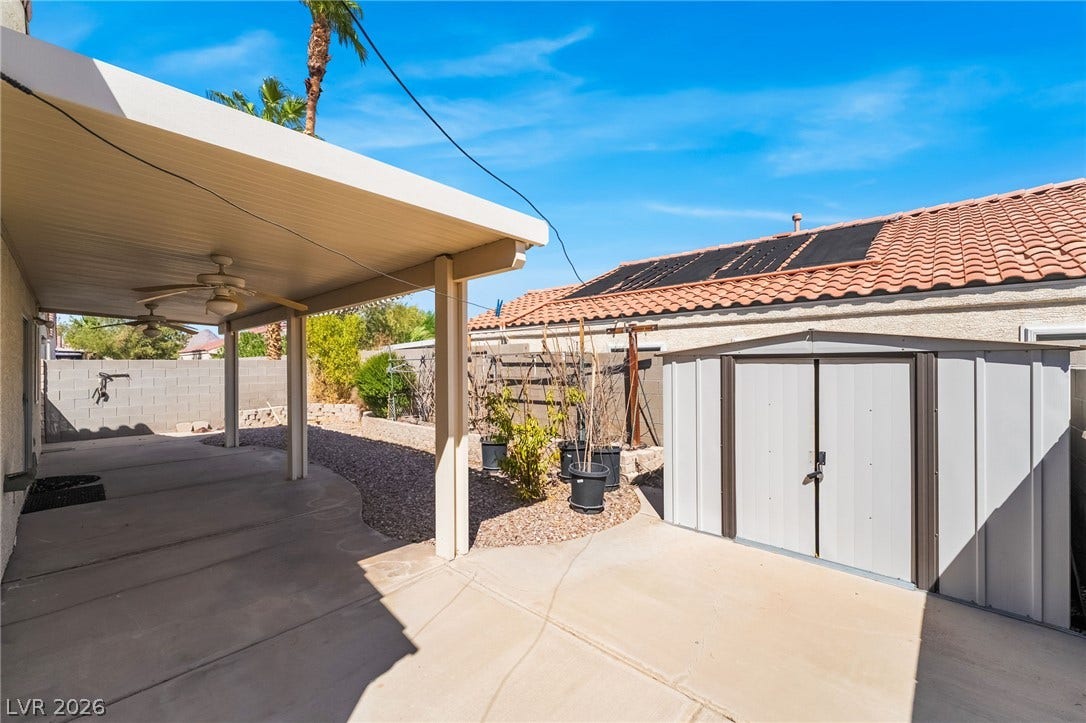 769 Salt Flats Circle, Henderson, NV 89011 A sheltered concrete patio overlooks the low-maintenance yard complete with a detached storage shed.
