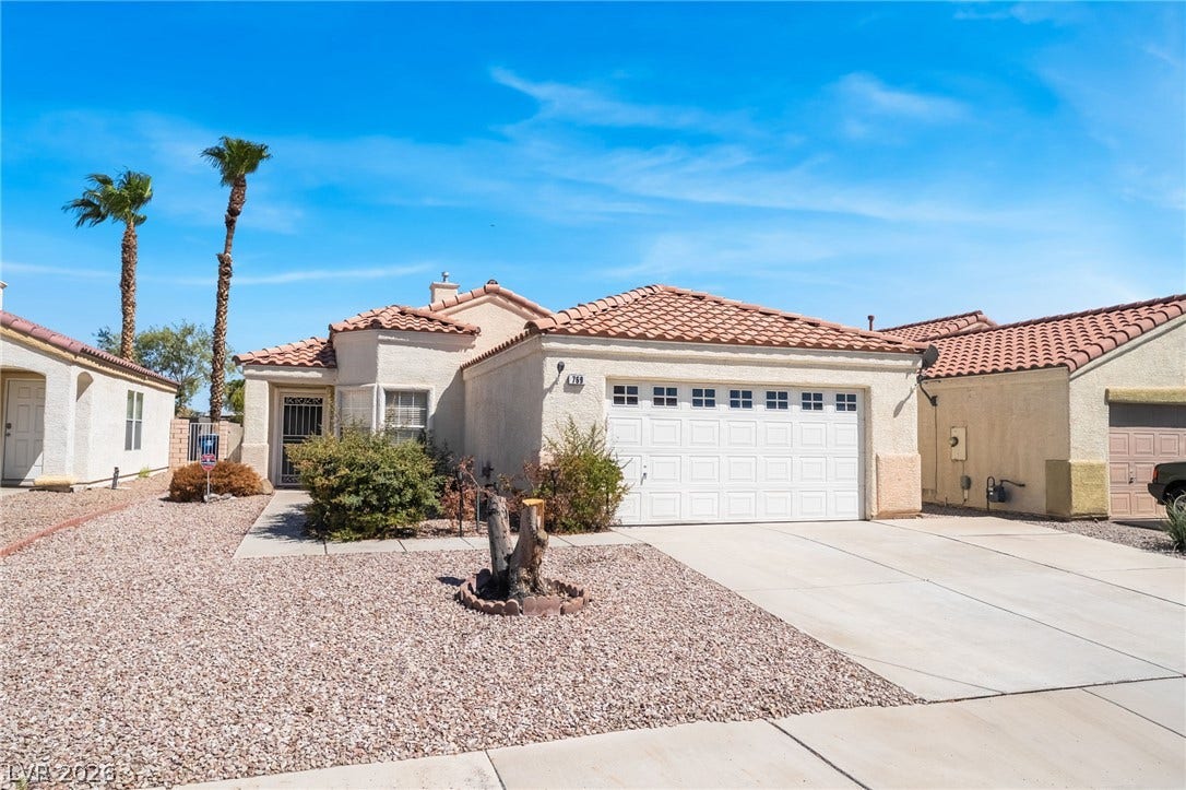 769 Salt Flats Circle, Henderson, NV 89011 Spanish tile roofing and classic stucco finishes define this desert-landscaped single-level home.