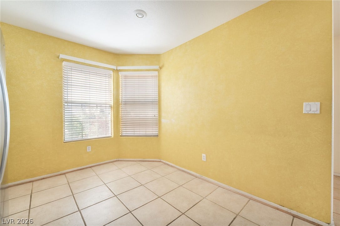 769 Salt Flats Circle, Henderson, NV 89011 Tiled flooring and large angled windows define this versatile dining area.