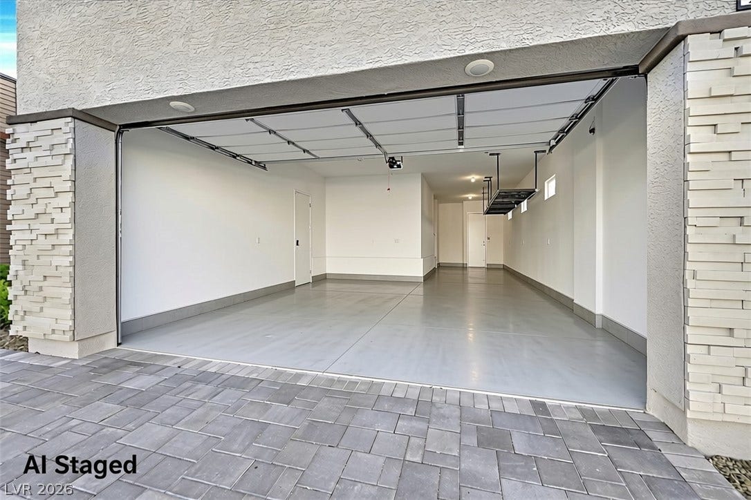2689 Pioneer Estates Court, Las Vegas, NV 89117 A spacious multi-car garage features durable concrete flooring and direct interior access.