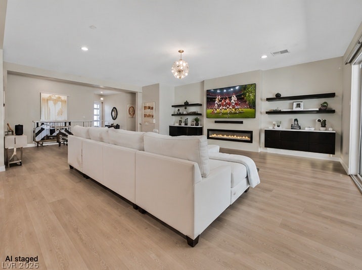2689 Pioneer Estates Court, Las Vegas, NV 89117 Clean lines and a modern fireplace define this open living area with wood floors.