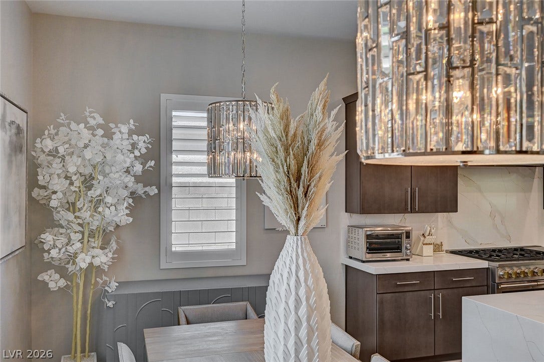 2689 Pioneer Estates Court, Las Vegas, NV 89117 Sophisticated modern finishes seamlessly blend the dining area with a gourmet kitchen.