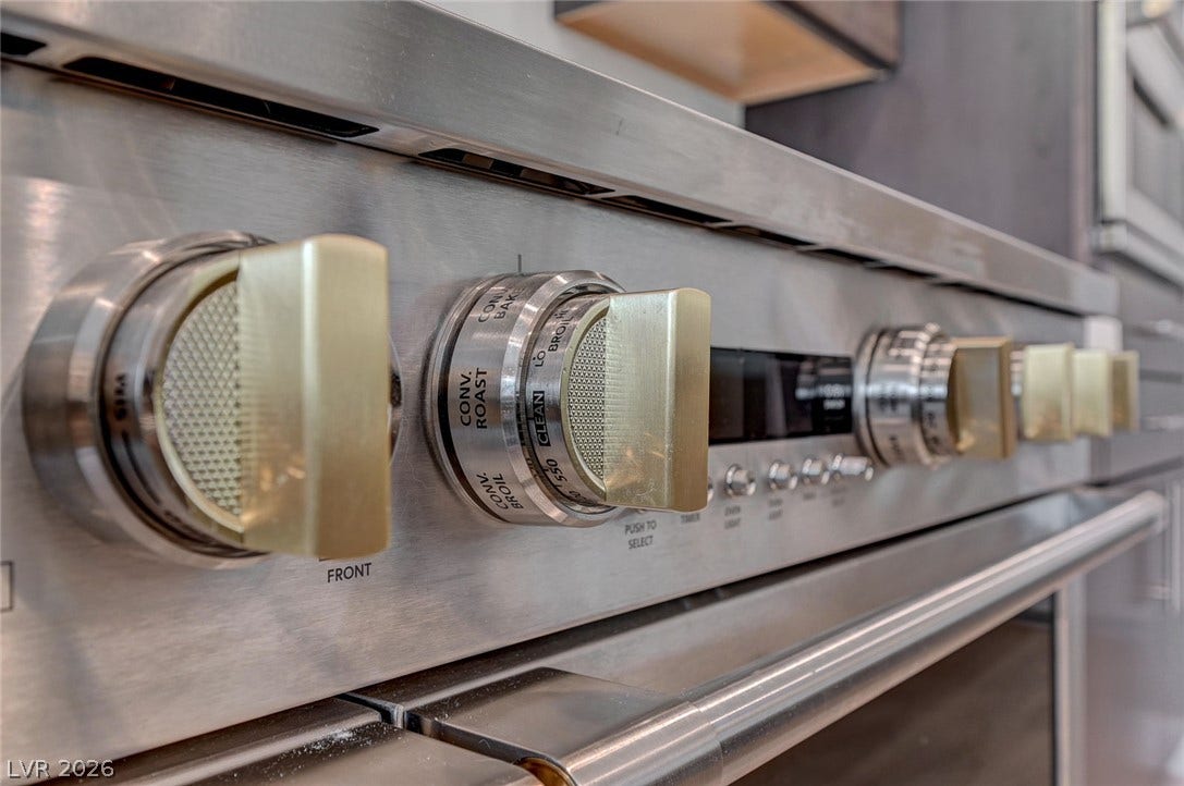 2689 Pioneer Estates Court, Las Vegas, NV 89117 Commercial-grade stainless steel cooking appliances elevate this modern culinary space.