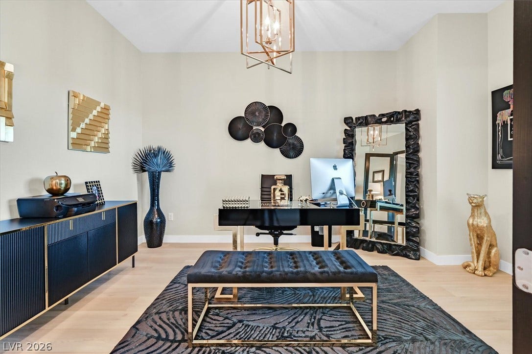 2689 Pioneer Estates Court, Las Vegas, NV 89117 High ceilings and light wood floors create an airy atmosphere in this quiet workspace.