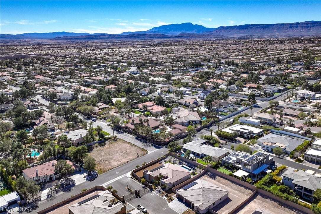 2689 Pioneer Estates Court, Las Vegas, NV 89117 Distant mountain ranges border this sprawling residential neighborhood under clear desert skies.