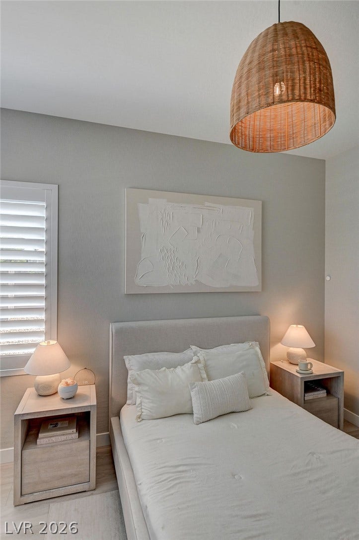 2689 Pioneer Estates Court, Las Vegas, NV 89117 Crisp plantation shutters and smooth walls define this serene bedroom space.