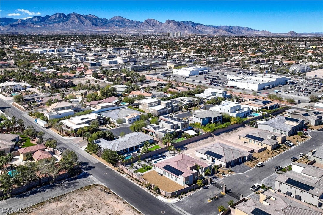 2689 Pioneer Estates Court, Las Vegas, NV 89117 Majestic mountain ridges border this expansive desert valley neighborhood under clear blue skies.