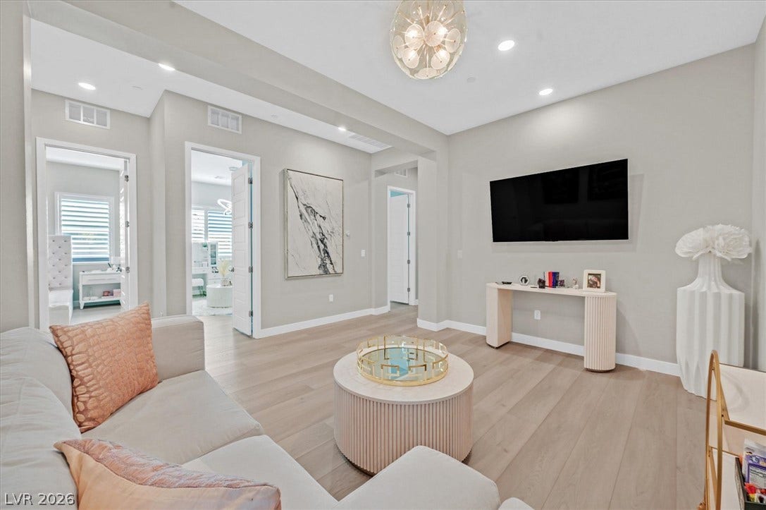2689 Pioneer Estates Court, Las Vegas, NV 89117 Recessed lighting and hardwood flooring define this open, modern living space.