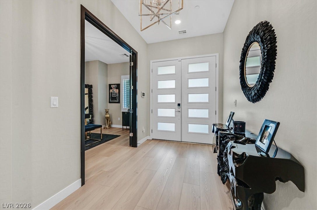 2689 Pioneer Estates Court, Las Vegas, NV 89117 Clean lines and light wood flooring define this welcoming entry space.