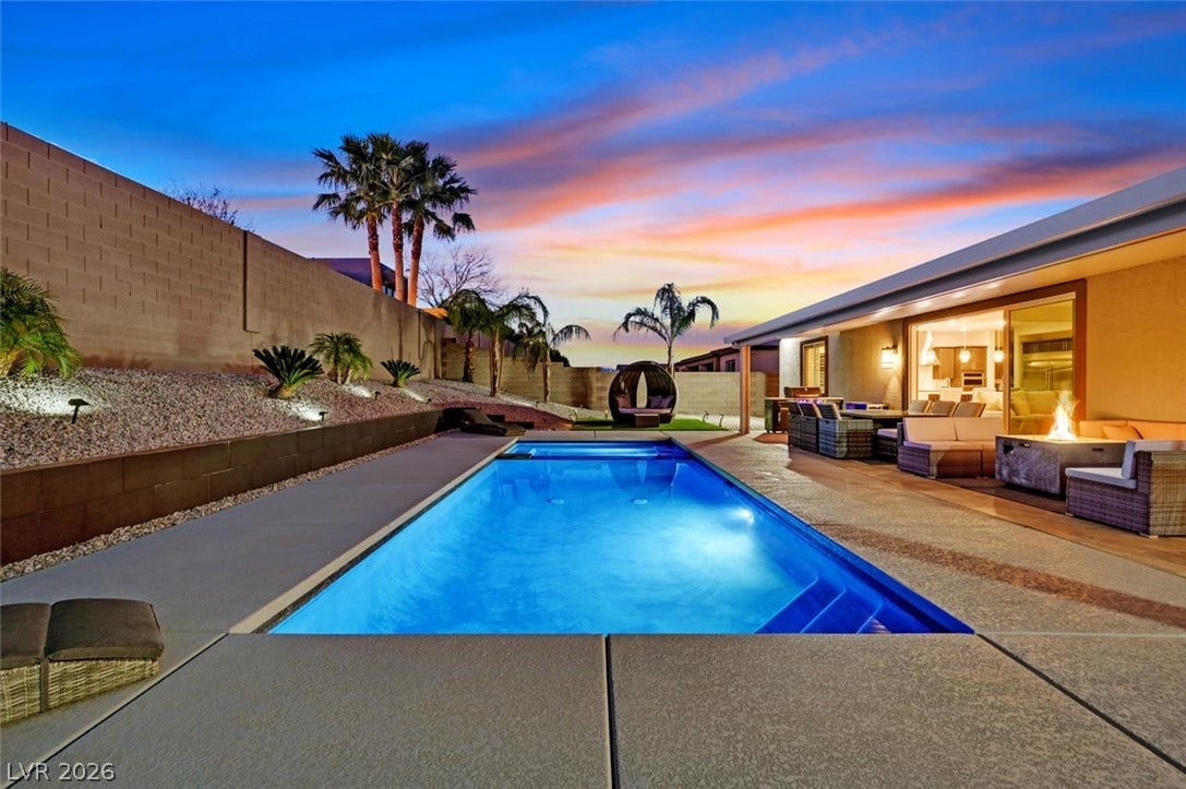 2689 Pioneer Estates Court, Las Vegas, NV 89117 A sparkling swimming pool anchors this private backyard retreat framed by a concrete patio.