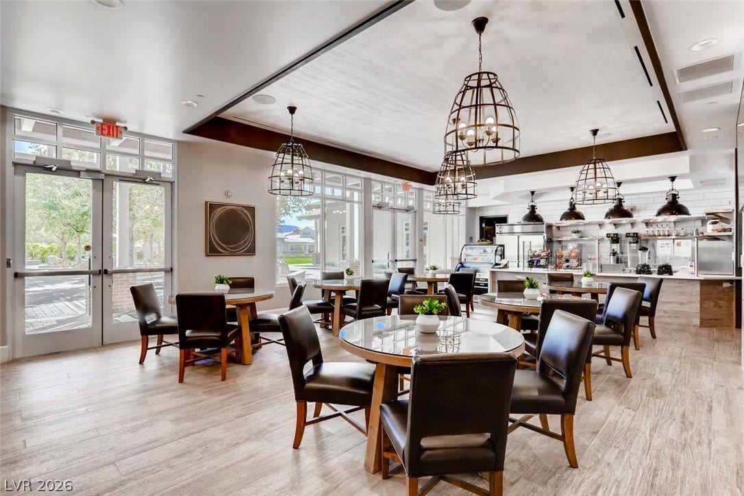 647 Longfeather Street, Henderson, NV 89011 Floor-to-ceiling glass doors flood this open dining venue with abundant natural light.