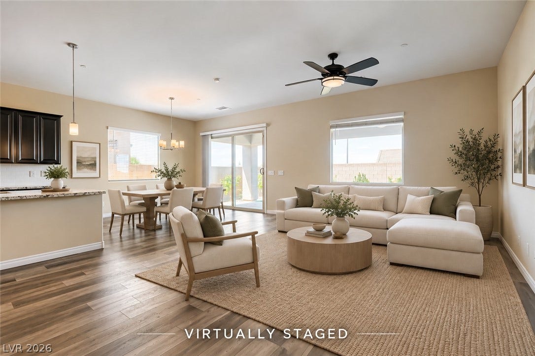 647 Longfeather Street, Henderson, NV 89011 An open floorplan seamlessly connects the airy living space to the adjacent dining area.