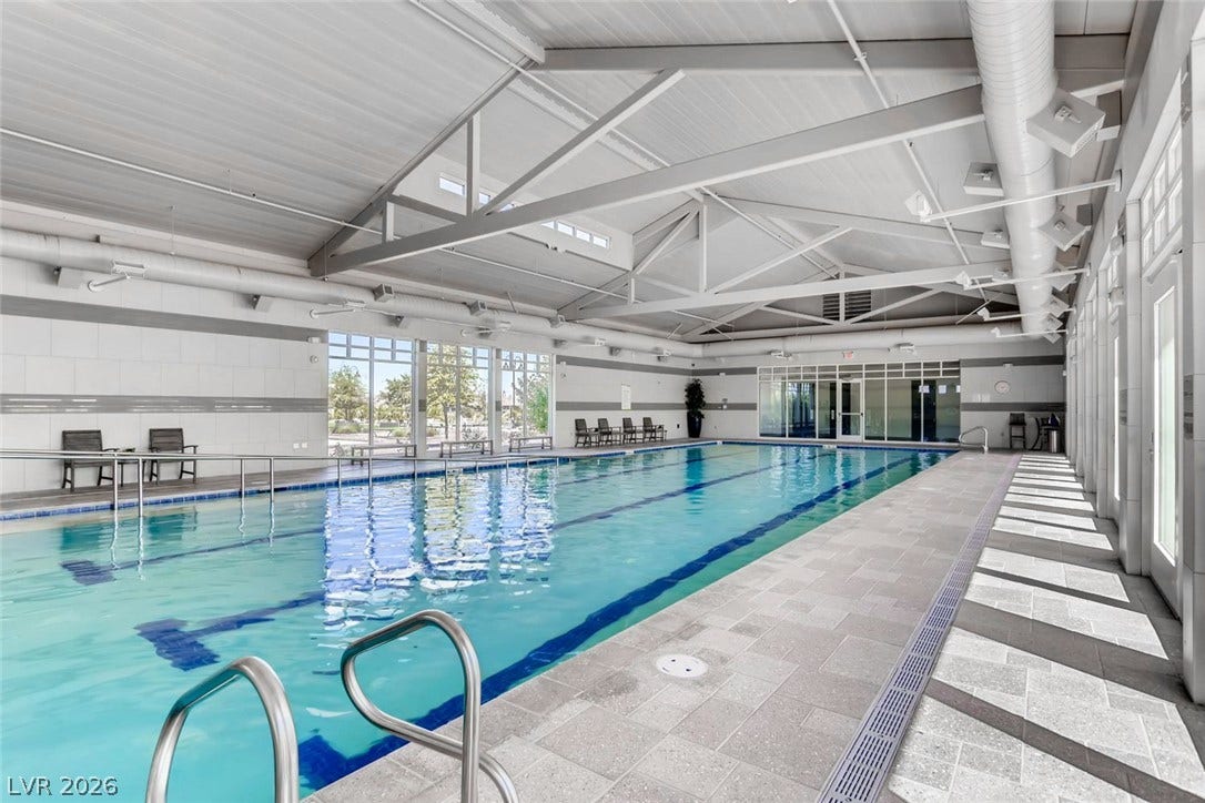 647 Longfeather Street, Henderson, NV 89011 Soaring vaulted ceilings and exposed steel trusses crown this magnificent indoor lap pool facility.
