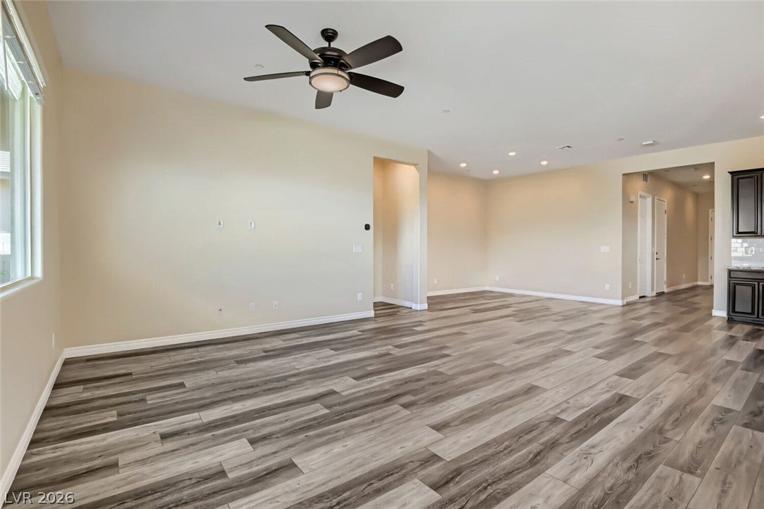 647 Longfeather Street, Henderson, NV 89011 An open floor plan connects the main living spaces over durable luxury wood-look flooring.