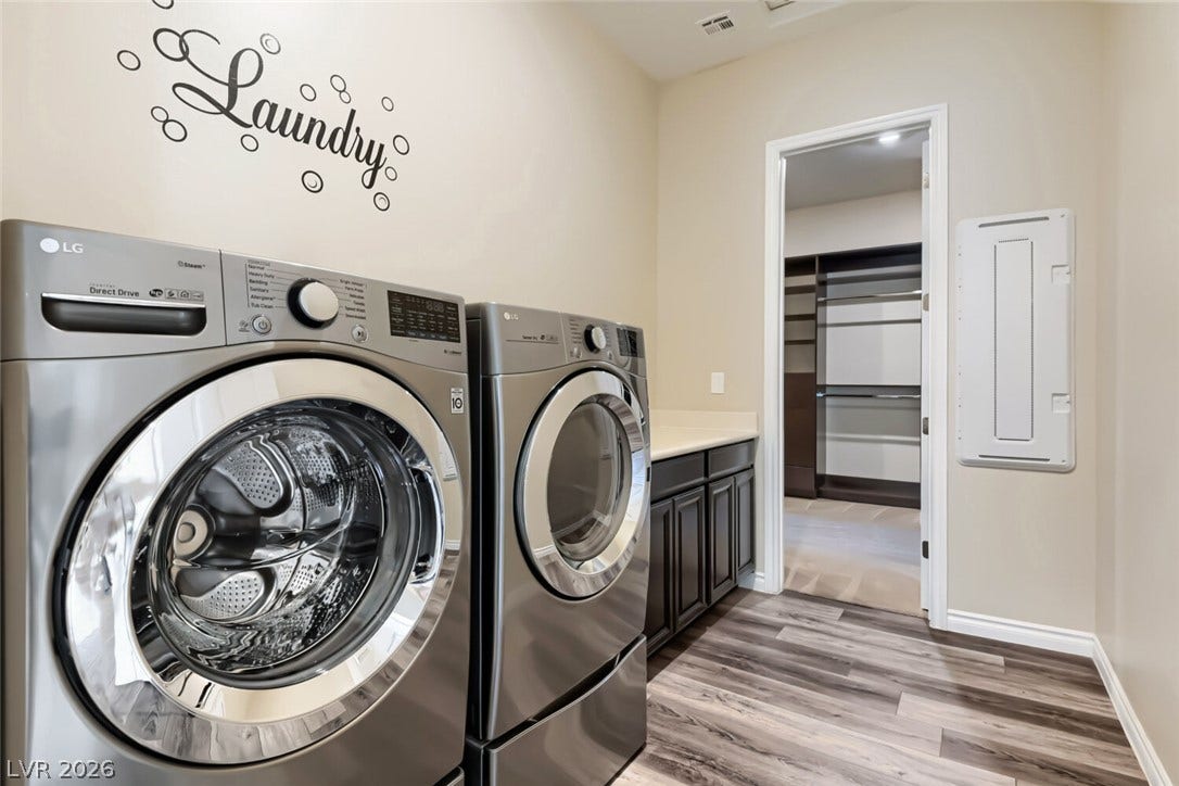 647 Longfeather Street, Henderson, NV 89011 A spacious utility room offers modern built-ins and direct access to a closet.