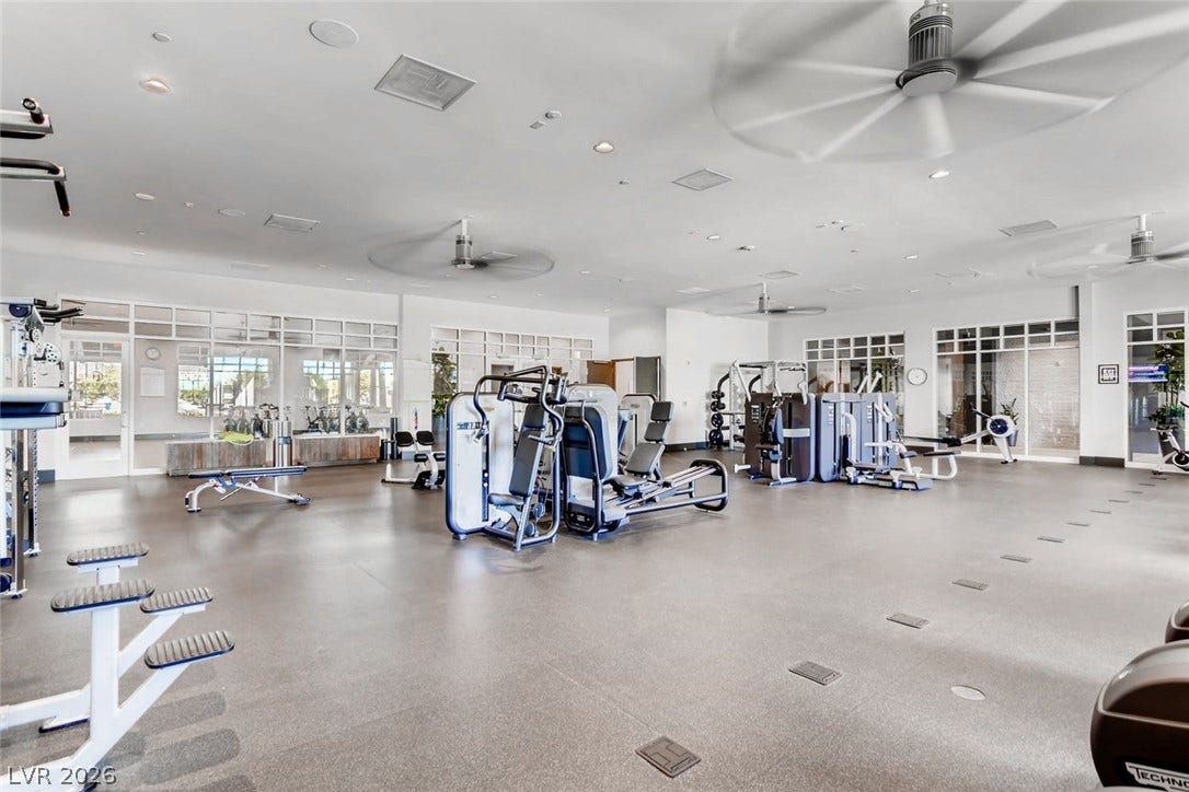 647 Longfeather Street, Henderson, NV 89011 Smooth rubber flooring under high ceilings defines this fully equipped fitness space.