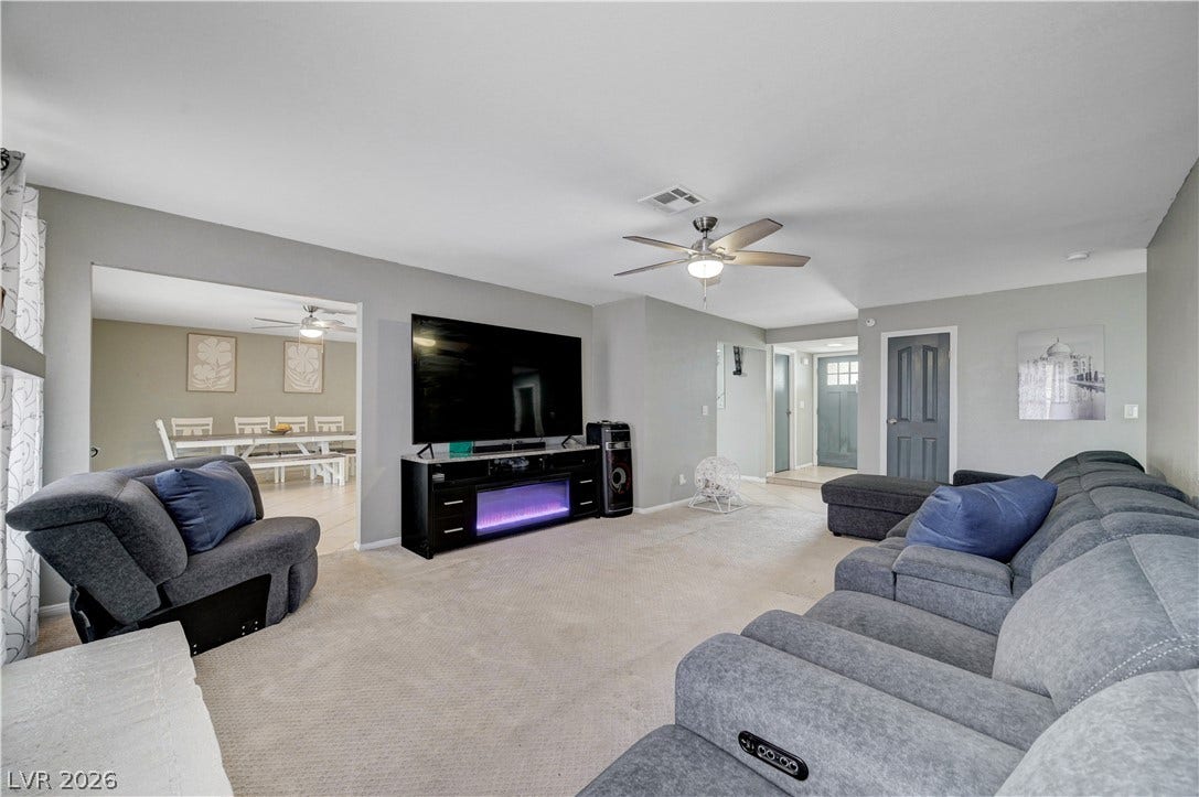 2829 N Michael Way, Las Vegas, NV 89108 An open layout connects the comfortable living spaces seamlessly over soft neutral carpeting.