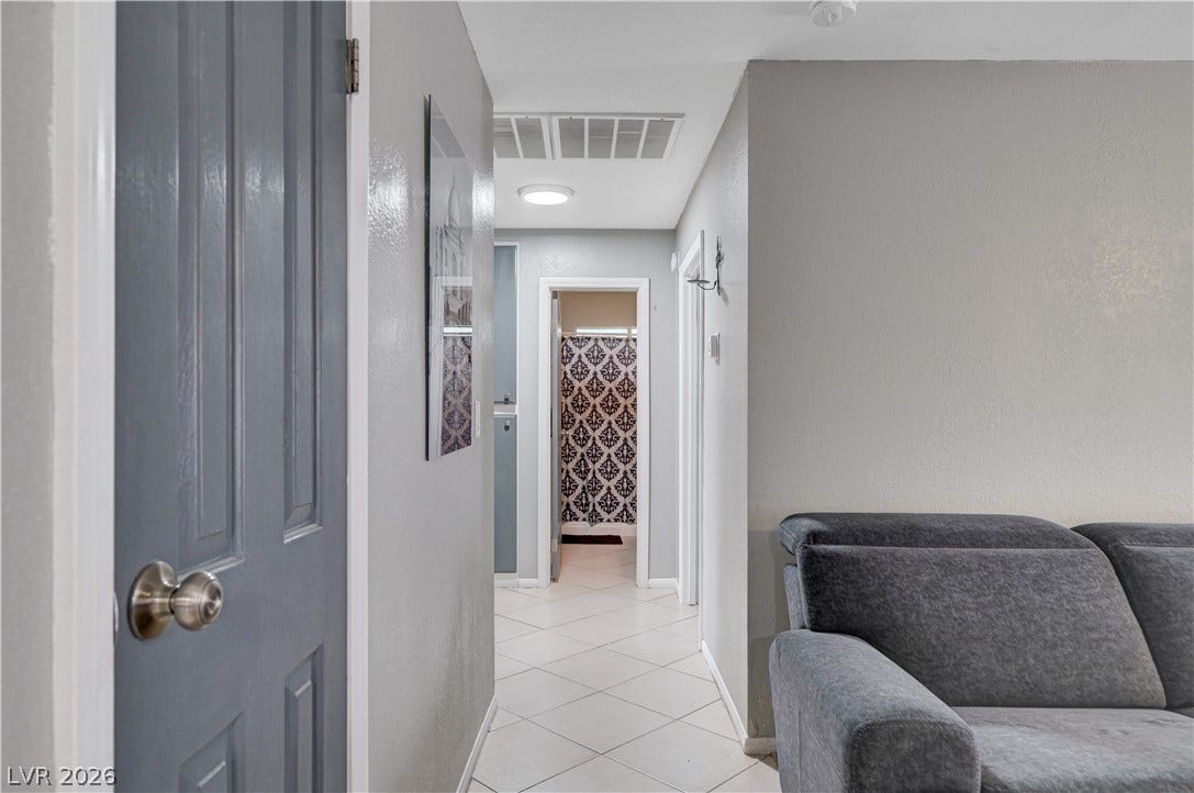2829 N Michael Way, Las Vegas, NV 89108 A tiled hallway connects the living areas to the bedrooms and baths.