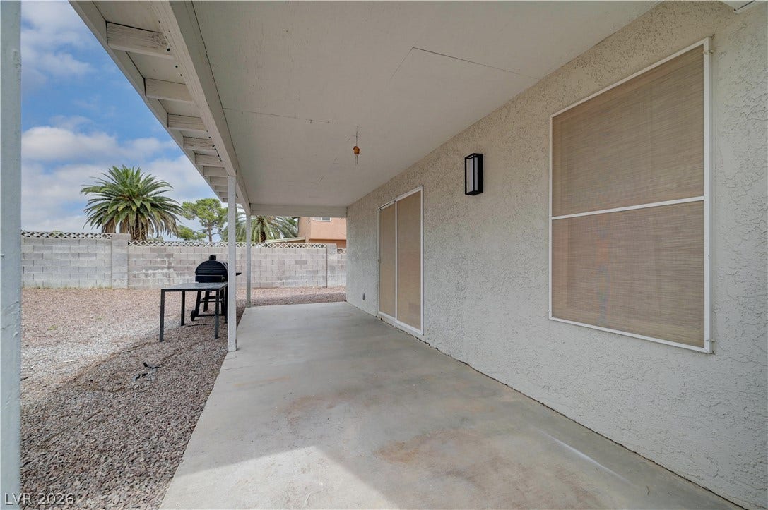 2829 N Michael Way, Las Vegas, NV 89108 An expansive covered patio provides a shaded outdoor space looking out toward the backyard.