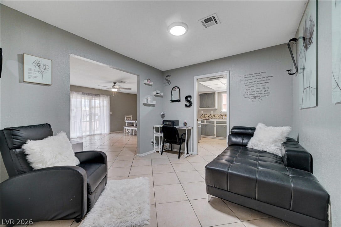 2829 N Michael Way, Las Vegas, NV 89108 Ceramic tile floors and a wide archway define this versatile interior layout.
