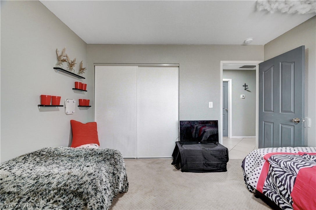 2829 N Michael Way, Las Vegas, NV 89108 Smooth plaster walls and soft carpeting define this comfortable bedroom space.