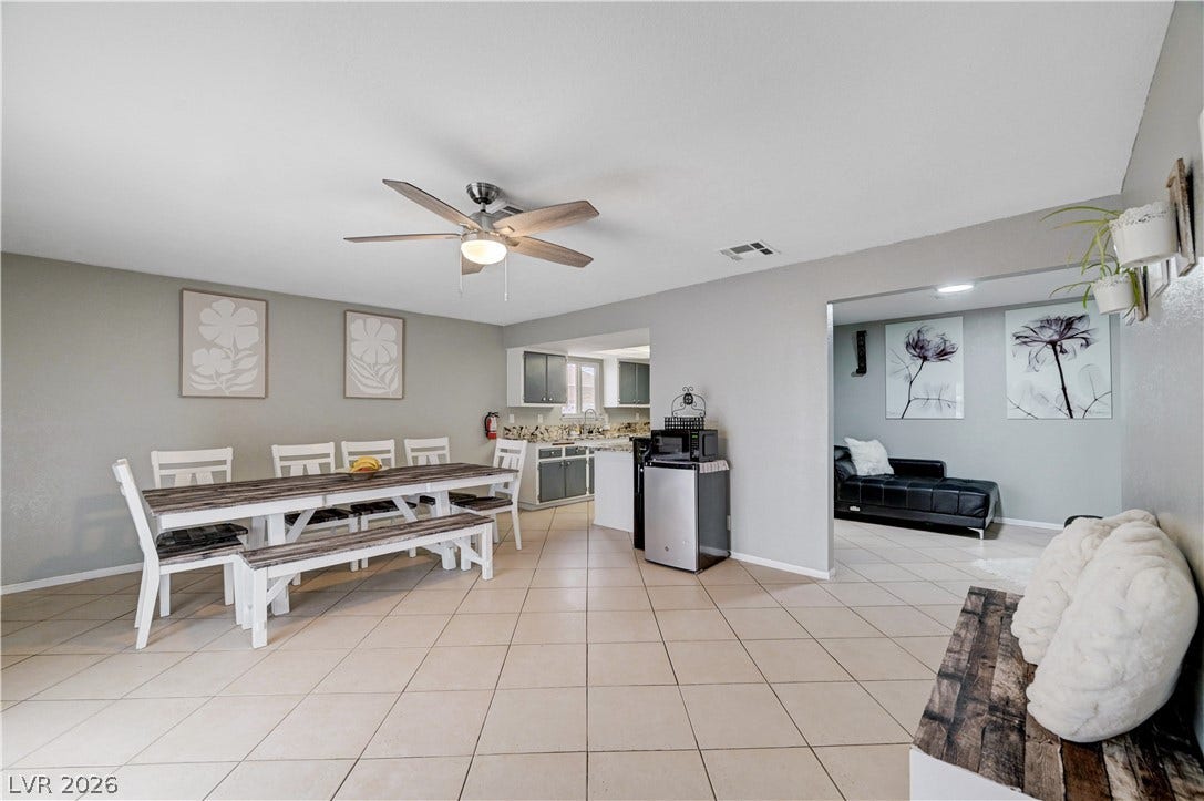 2829 N Michael Way, Las Vegas, NV 89108 Tiled flooring flows through this open layout connecting the dining space and kitchen.