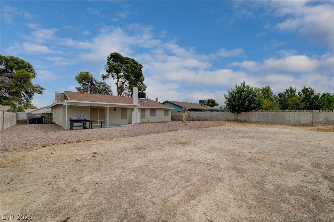 2829 N Michael Way, Las Vegas, NV 89108 A spacious backyard area surrounded by block fencing offers endless outdoor possibilities.