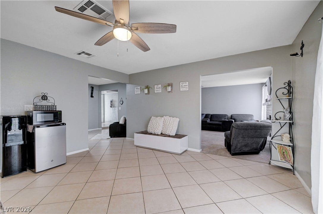 2829 N Michael Way, Las Vegas, NV 89108 Smooth tile flooring extends throughout this versatile living area with wide open doorways.