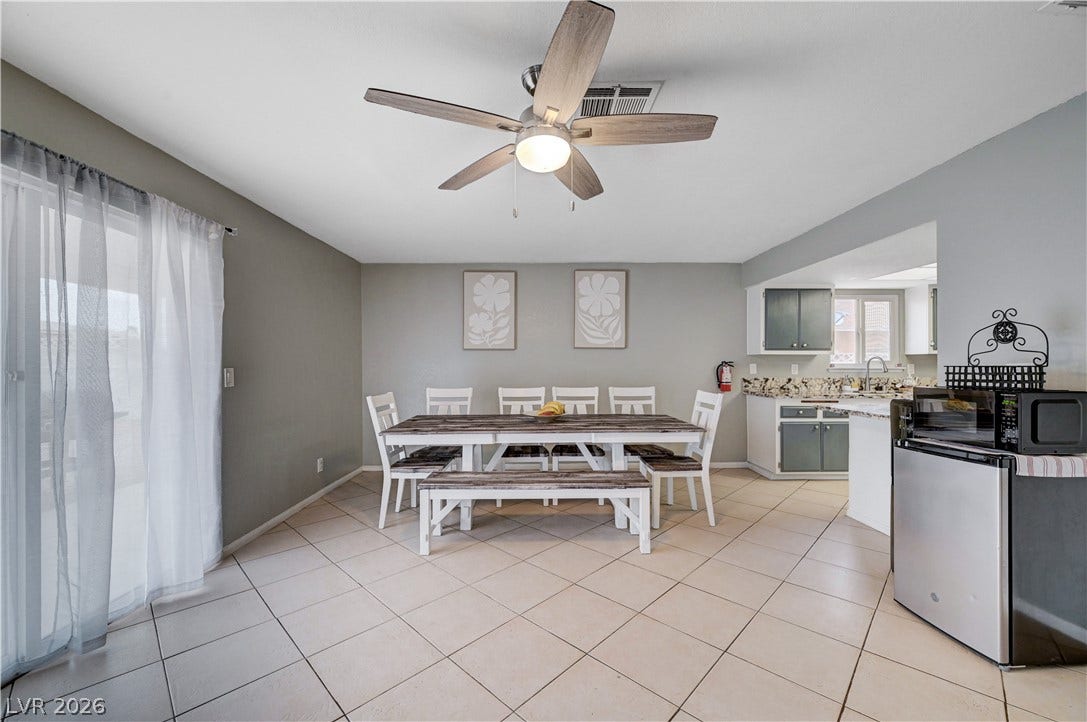 2829 N Michael Way, Las Vegas, NV 89108 Tiled flooring and sliding glass doors enhance this versatile dining area adjacent to the kitchen.