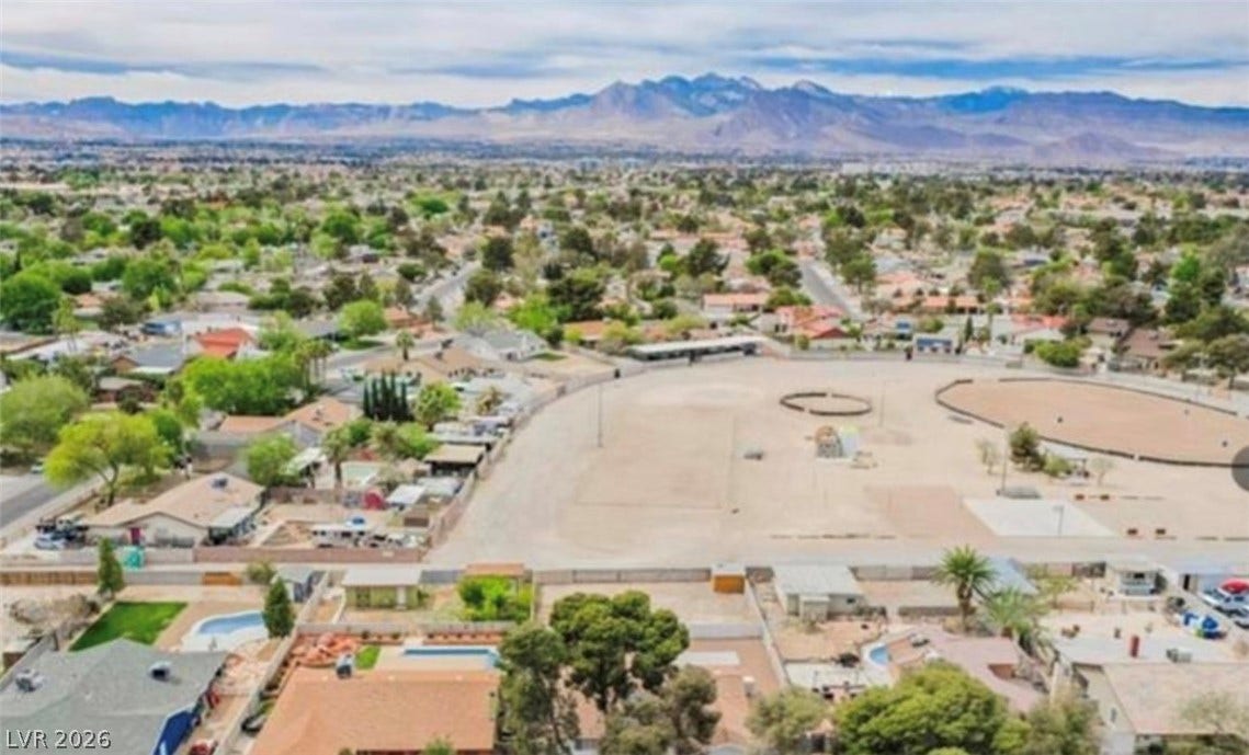 2829 N Michael Way, Las Vegas, NV 89108 Majestic mountain ranges rise in the distance beyond this expansive neighborhood landscape.