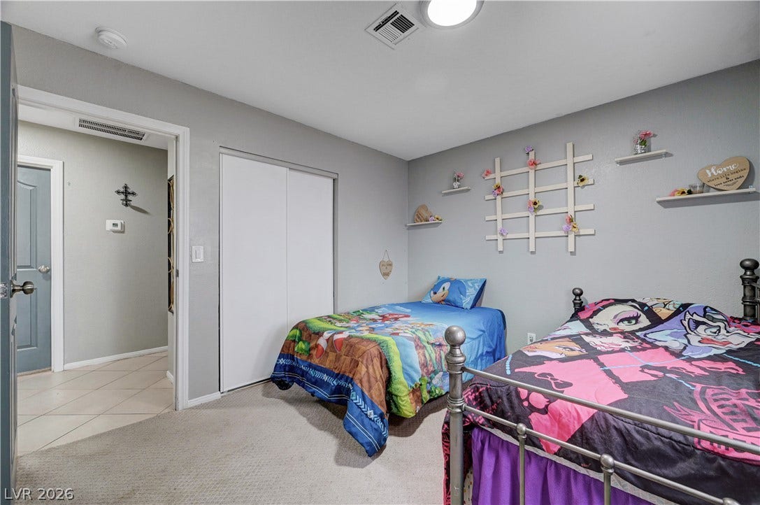 2829 N Michael Way, Las Vegas, NV 89108 Soft carpeting underfoot defines this cozy bedroom space.
