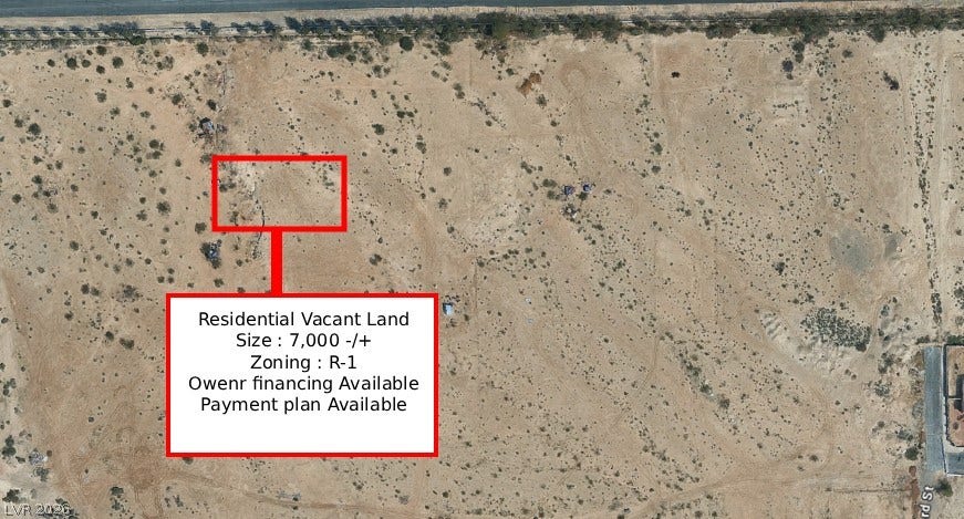 Tamrin, North Las Vegas, NV 89030 Aerial view outlines a residential vacant lot surrounded by arid natural landscape.