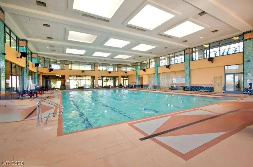 2237 Merrimack Valley Avenue, Henderson, NV 89044 Natural light streams through overhead skylights onto the expansive indoor swimming pool.