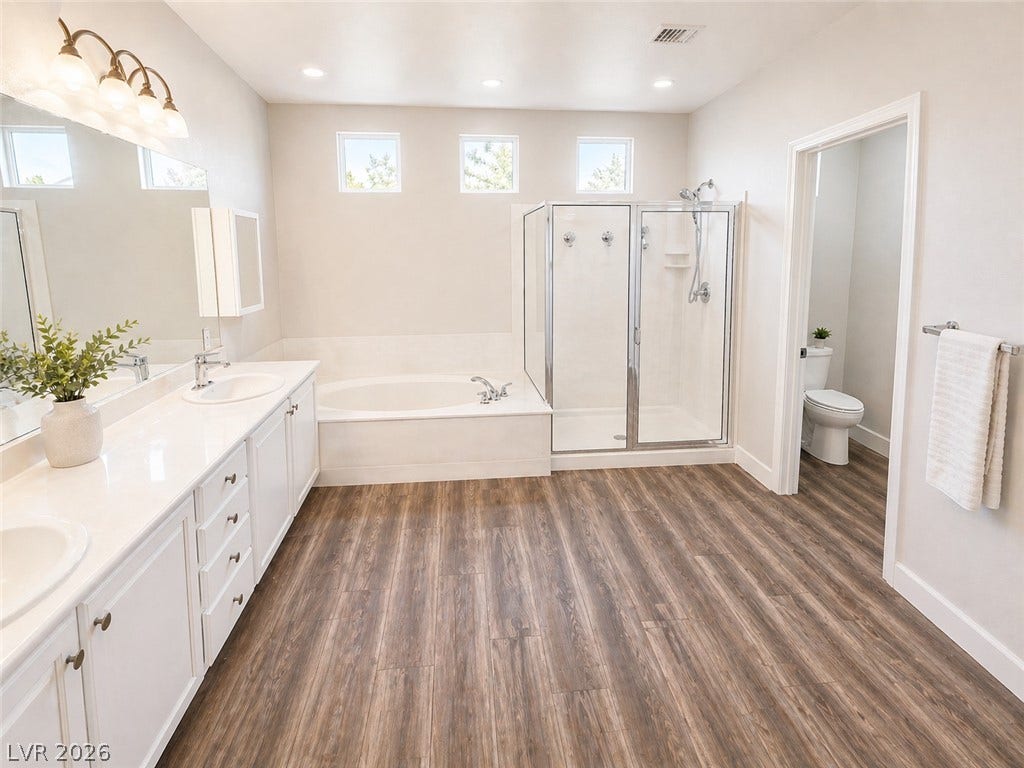 2237 Merrimack Valley Avenue, Henderson, NV 89044 Open plan Primary Bathroom lots of cabinet space
spacious bathroom equipped with a double vanity and soaking tub. Lots of closet space