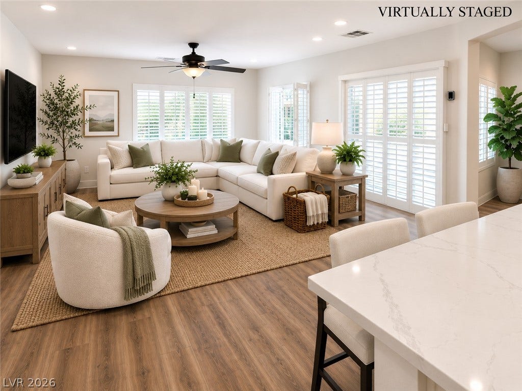 2237 Merrimack Valley Avenue, Henderson, NV 89044 Warm tile flooring and plantation shutters define this inviting, light-filled living area. Leading out to the inviting pool and spa