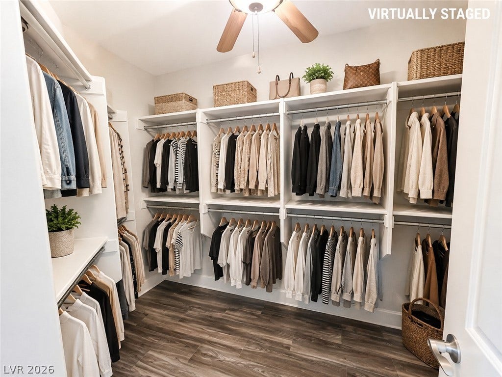 2237 Merrimack Valley Avenue, Henderson, NV 89044 An organized walk-in closet boasts custom built-in shelving over rich tile plank flooring.