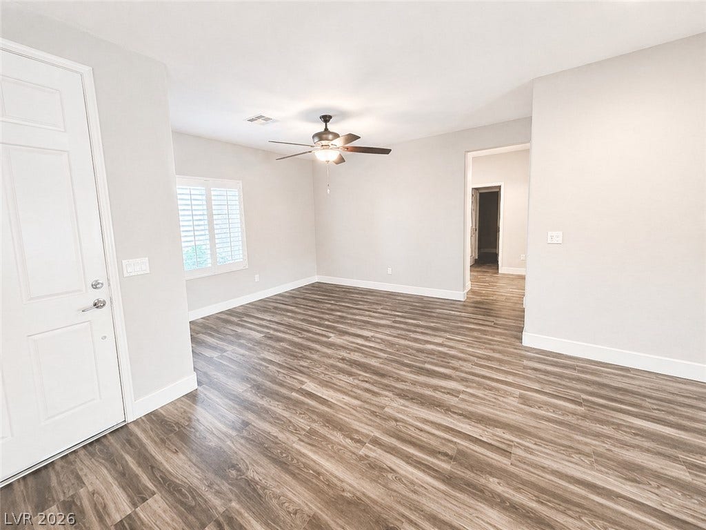 2237 Merrimack Valley Avenue, Henderson, NV 89044 Rich tile-look flooring anchors this open living space illuminated by natural light.