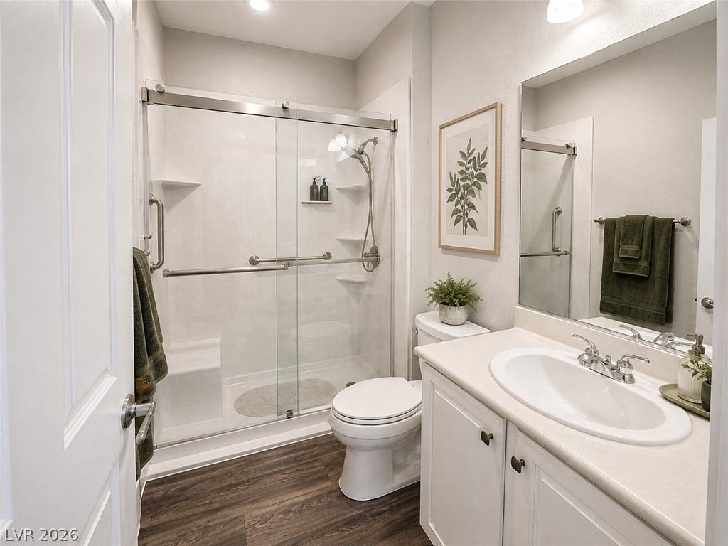 2237 Merrimack Valley Avenue, Henderson, NV 89044 All New guest bathroom with sliding glass shower door and title flooring enhance this pristine modern bathroom.