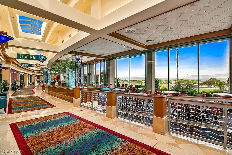 2237 Merrimack Valley Avenue, Henderson, NV 89044 Massive floor-to-ceiling windows flood this elegant common area with abundant natural light.