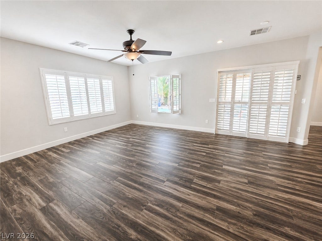 2237 Merrimack Valley Avenue, Henderson, NV 89044 Slider Doors leads out to an oases pool and spa plantation shutters define this versatile living space.