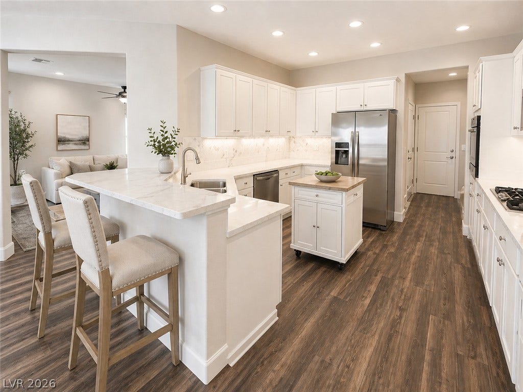 2237 Merrimack Valley Avenue, Henderson, NV 89044 Rich tile flooring contrasts beautifully with classic white cabinetry new and sleek quarts countertops. recessed lighting and under counter lighting