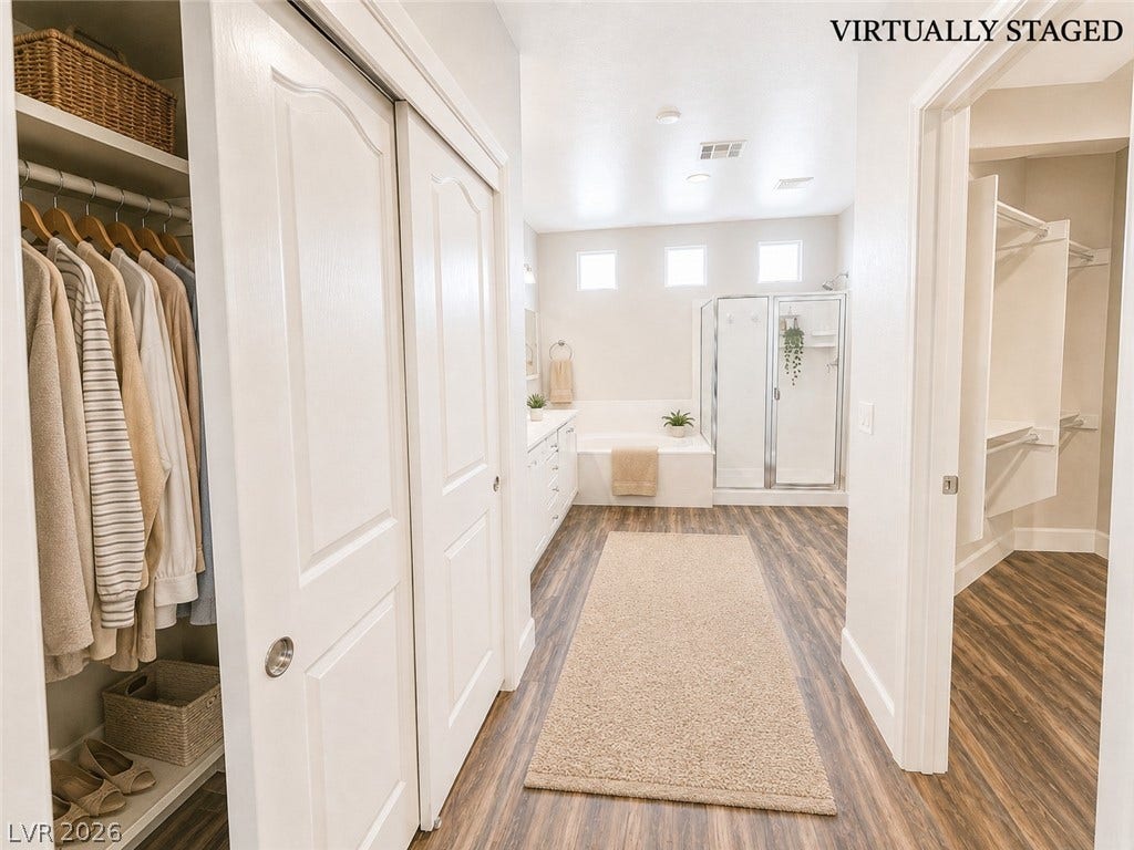 2237 Merrimack Valley Avenue, Henderson, NV 89044 A spacious walk-in closet connects seamlessly to a modern bathroom with tile flooring.