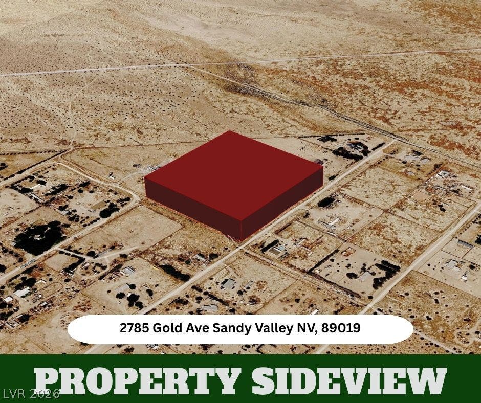 An aerial perspective showcases the spacious lot nestled within a desert landscape setting.