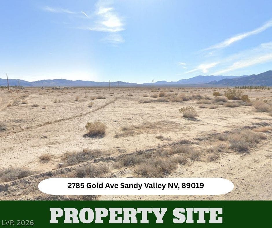 A spacious desert lot provides a blank canvas set against a distant mountain backdrop.