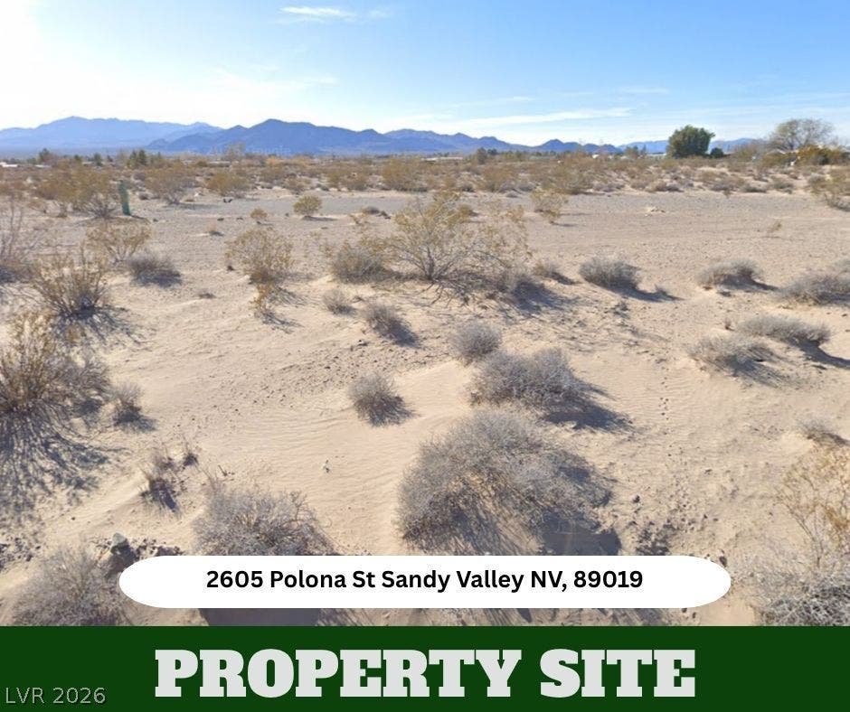 Vast desert views stretch toward distant mountain ranges under clear skies.