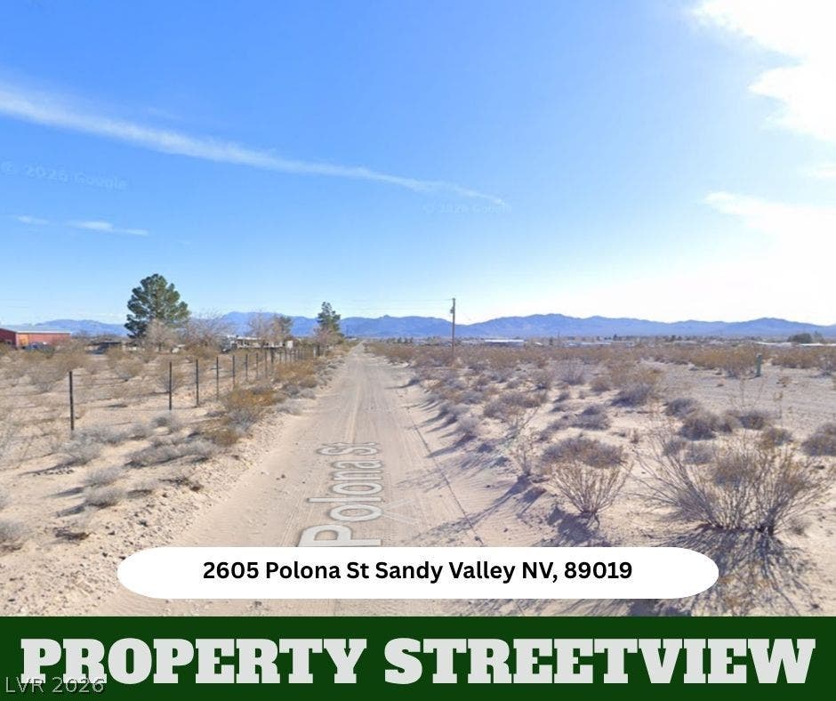 Distant mountain ranges border the vast desert landscape along this quiet rural roadway.